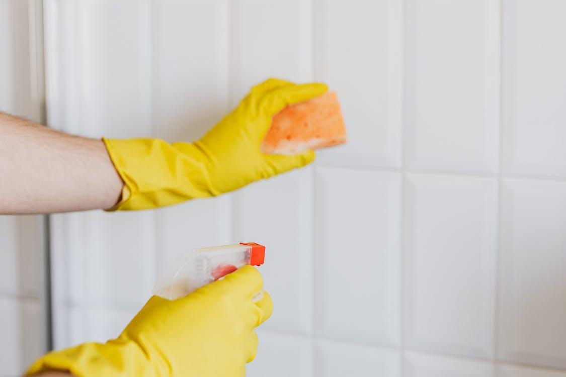 Cleaning Tiles With Sponge